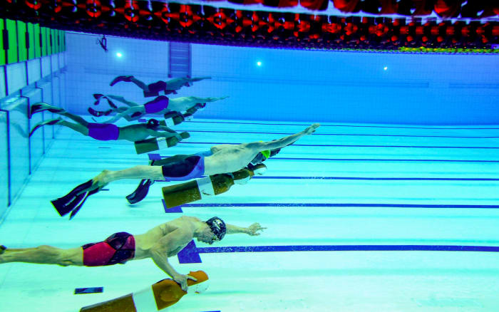 Competitive lifesaving involves equipment of many kinds, including fins.
